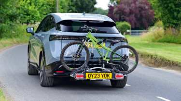 Nissan Ariya (with bikes fitted to rack) - rear tracking