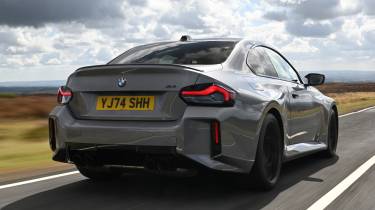 New BMW M2 being driven in the UK - rear tracking 