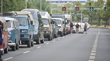 Line-up of Volkswagen vans on road