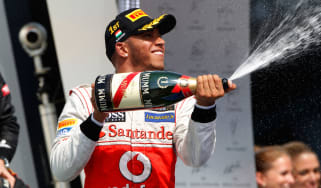 Lewis Hamilton celebrates on the podium