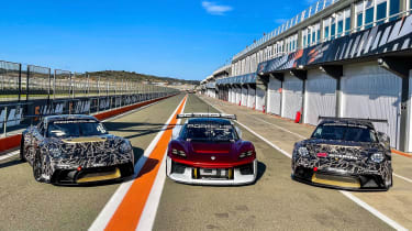 Porsche 718 Cayman GT4 ePerformance - three cars in pit
