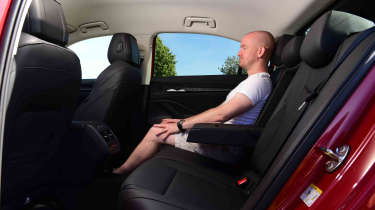 Skoda Superb hatch - rear seats with Chief reviewer Alex Ingram