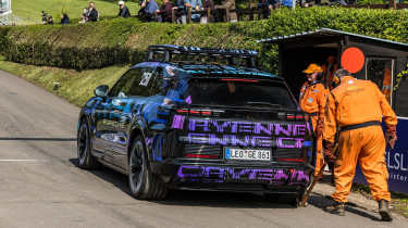 Porsche Cayenne Electric - rear 3/4 on a start line