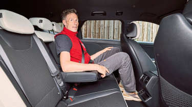 Holger Preiss sitting in the Kia K4 Sportswagon's rear seat