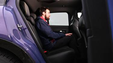Abarth 600e Scorpionissima - rear seats being sat in by Sam Naylor 