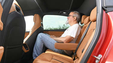 Mazda 6e in the UK - rear seats being sat in by Auto Express senior test editor Dean Gibson 