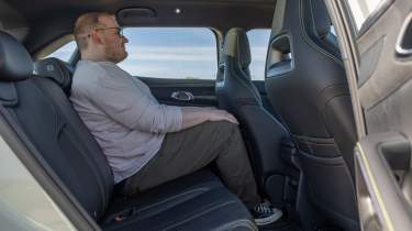 Ellis Hyde testing the rear seats in the BYD Atto 2