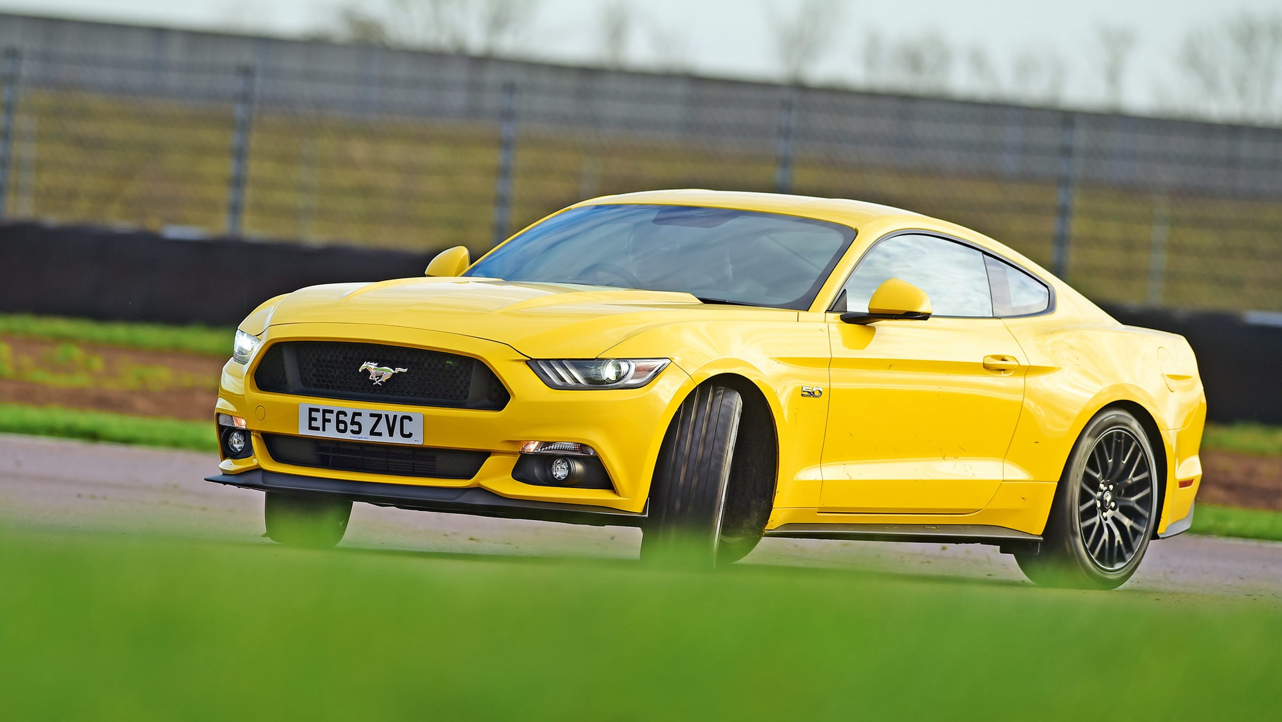 Ford Mustang vs Jaguar F-Type R | Auto Express