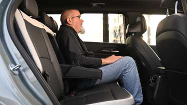 Auto Express senior road test editor Dean Gibson sitting in the Kia EV5's back seat