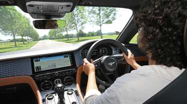 Auto Express news editor Jordan Katsianis driving theBentley Continental GT