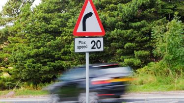 Vehicle speeding into bend