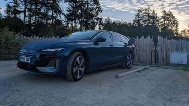 Audi A6 Avant e-tron connected to an EV charger