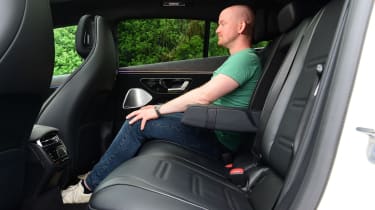 Auto Express chief reviewer Alex Ingram sitting in the back seats of the Mercedes-AMG EQS 35