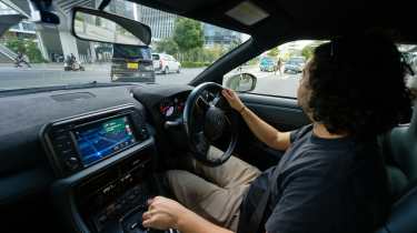 Auto Express senior staff writer Jordan Katsianis driving the Nissan GT-R T-Spec