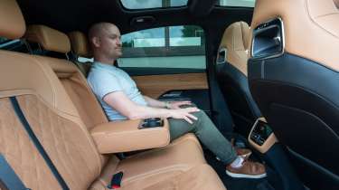 Auto Express chief reviewer Alex Ingram sitting in the Mazda 6e&#039;s rear seat