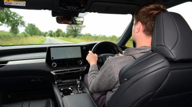 Auto Express staff writer Alastair Crooks driving the Lexus RX 500h in the UK
