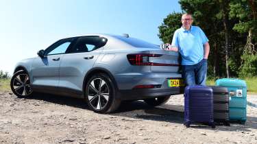 Auto Express editor-at-large John McIlroy leaning on the Polestar 2 Single Motor