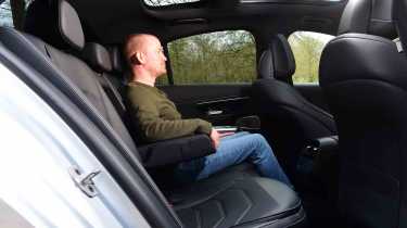 Mercedes E-Class E 300 e - rear seats with Senior reviewer, Alex Ingram