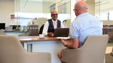 Jaguar F-pace long termer - Ahmed Rahman and Stuart Milne talking at desk