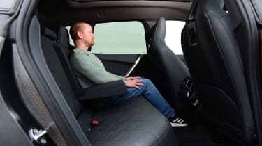 Auto Express chief reviewer Alex Ingram sitting in the BMW iX&#039;s back seat