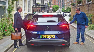 Out-going Renault UK boss Guillaume Sicard and John McIlroy getting into the back of a Renault Scenic