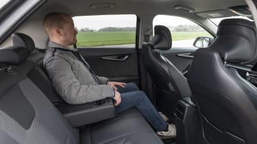 Auto Express chief reviewer Alex Ingram sitting in back seat of Kia Niro EV