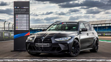 BMW M3 Touring - parked by scoreboard