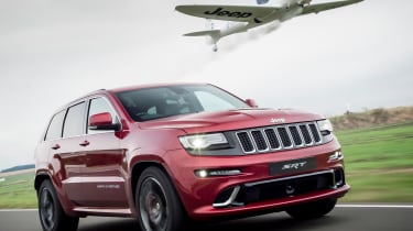 Jeep Grand Cherokee SRT8 vs plane - pictures  Auto Express