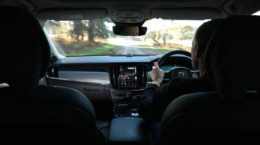 Auto Express editor-at-large Phil McNamara driving a Volvo V90
