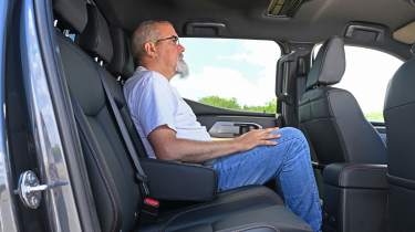 Auto Express senior test editor Dean Gibson sitting in the Mitsubishi L200's rear seat