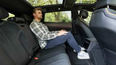 Auto Express senior news reporter Alastair Crooks sitting in the Denza Z9GT EV's rear seat