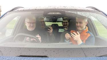 Auto Express team members playing Uno in a car (exterior)