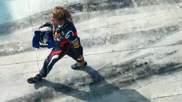 Sebastian Vettel returns to the Red Bull garage