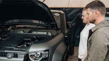 Auto Express news reporter Ellis Hyde and Shaun Birch looking at the Land Rover Defender OCTA&#039;s engine bay