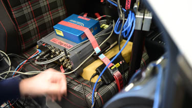 Tyre testing computer equipment mounted on a Volkswagen Golf Mk7 front passenger seat