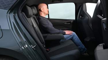 Auto Express chief reviewer Alex Ingram sitting in the Cupra Born&#039;s back seat