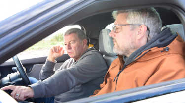 Auto Express consumer editor Chris Rosamond and contributor Steve Sutcliffe sitting inside a Polestar 2