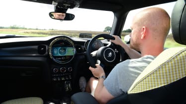 Auto Express chief reviewer Alex Ingram driving the MINI Electric
