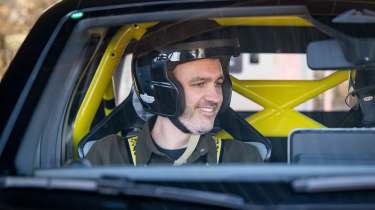 Auto Express deputy editor Richard Ingram sitting inside the Renault 5 Turbo 3E