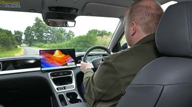 New Geely EX2 - interior, car being driven by Auto Express news reporter Ellis Hyde