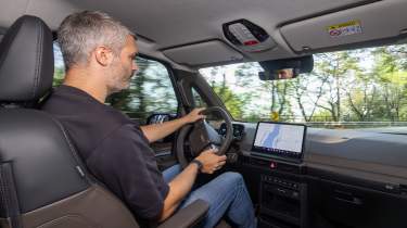 Rich Ingram driving the Kia PV5