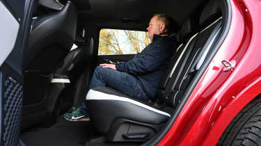 Auto Express executive editor Paul Adam sitting in the Kia EV6&#039;s back seat