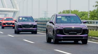 Collection of Lepas SUVs driving on motorway - front