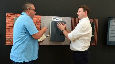 Chief operations officer Gary Pearson showing an Andersen wallbox to John McIlroy