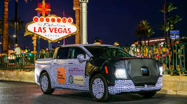 Ford Fathom prototype driving past the Las Vegas sign