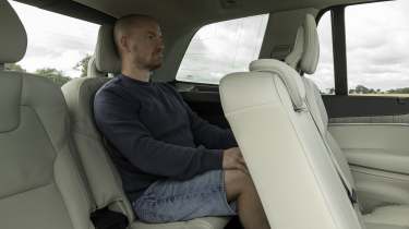 Volvo XC90 - rear 3rd row of seats being sat in by Auto Express chief reviewer Alex Ingram 