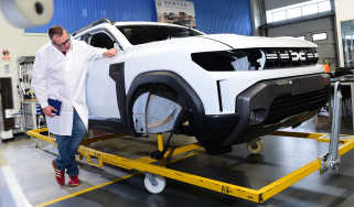 John McIlroy inspecting a Dacia Duster bodyshell