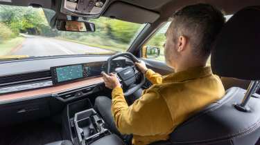Richard Ingram driving the KGM Musso EV