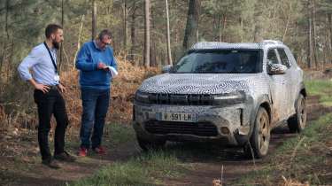 John McIlroy and Philippe Turchet inspecting the Dacia Duster