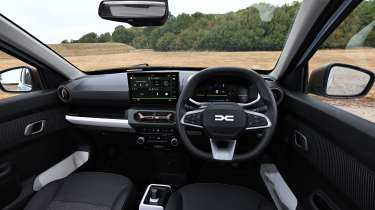 Dacia Spring Extreme - front interior